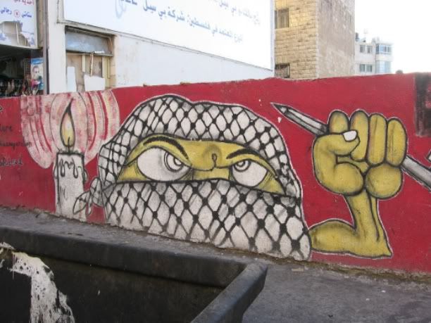 bansky art graffiti on the Palestinian wall