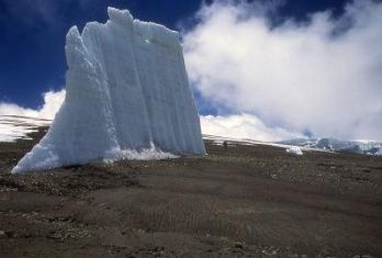 This is one of a growing number of isolated remnants of ice spires that were once full glaciers in the crater of Mount Kilimanjaro in Africa. Photo by: Lonnie Thompson, Ohio State University. 