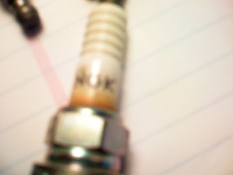 Is it normal for a spark plug insulator to look burnt like this